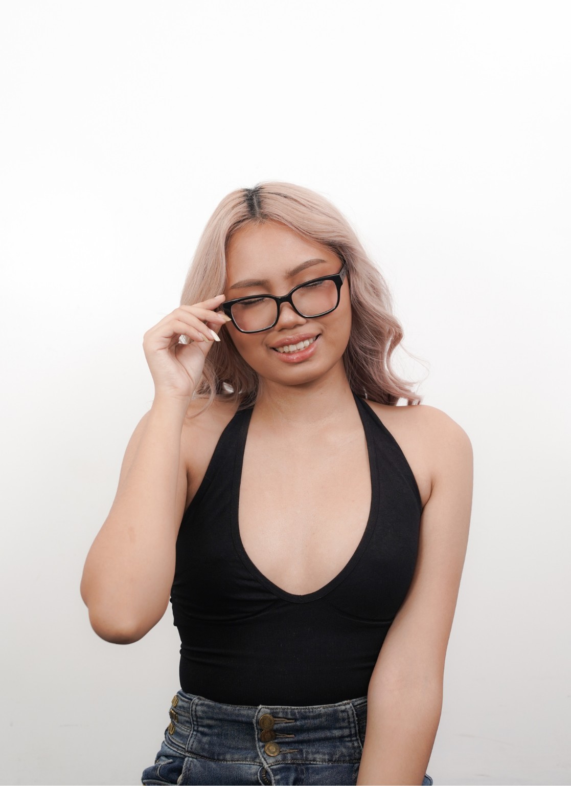 Althea Louise posing in a black top and glasses
